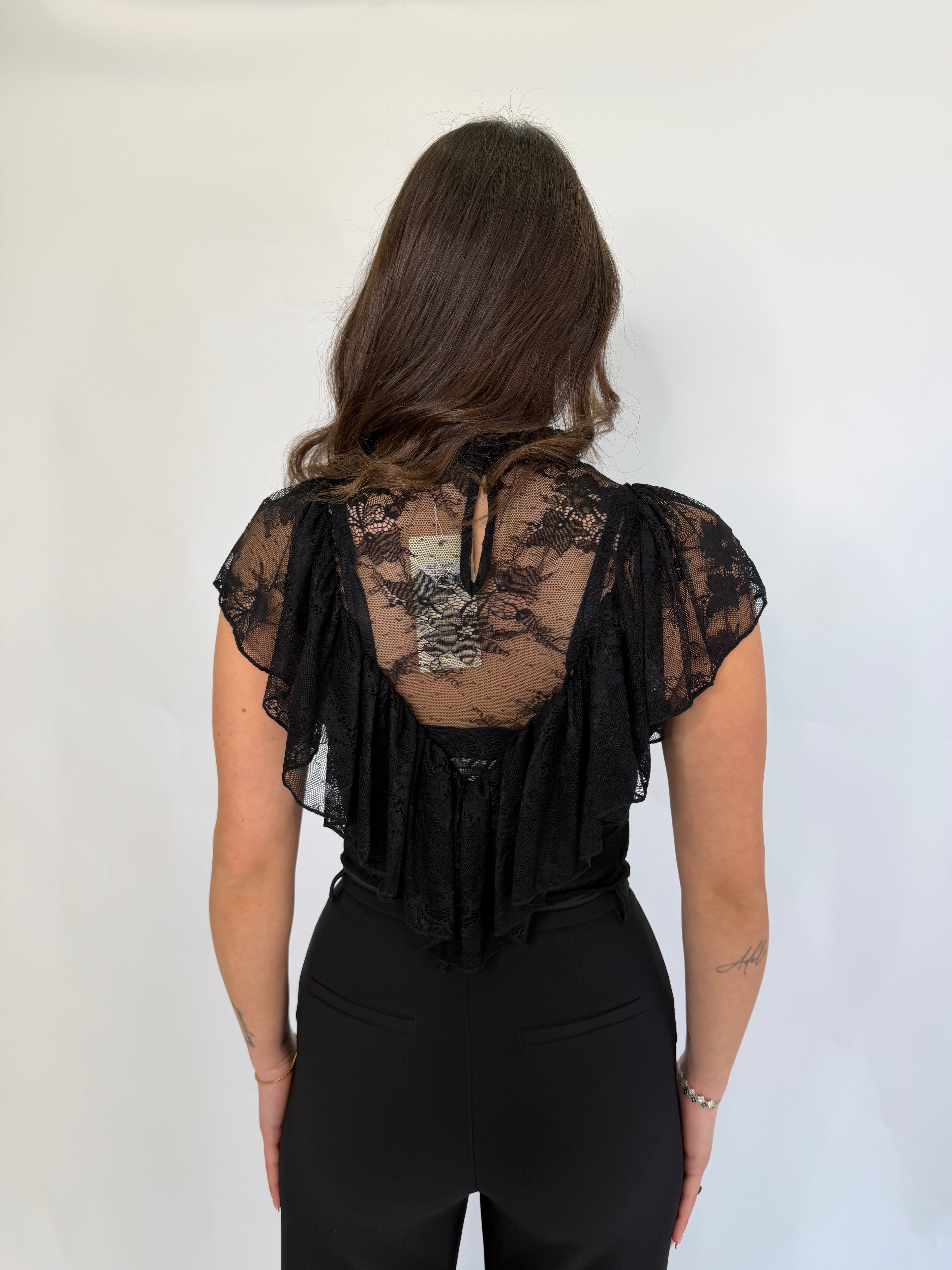Maglia in pizzo con volant